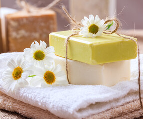 Obraz na płótnie Canvas Soap bars chamomile, closeup view. Natural herbal beauty products