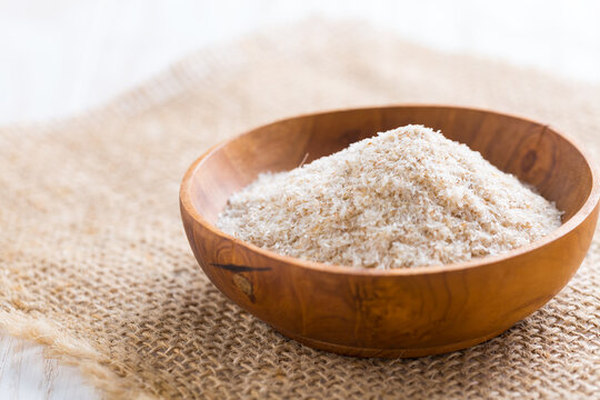 Heap of psyllium husk in wooden bowl