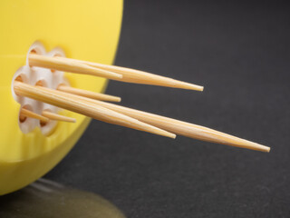Toothpicks close up. Macro . Sharpened wooden sticks.