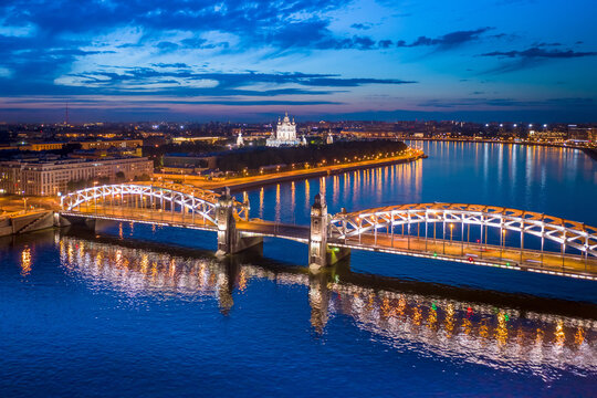 Saint Petersburg. Russia. White nights in St. Petersburg. Bridges Of St. Petersburg. View from the height of the Peter the Great bridge and the evening city. Bolsheokhtinsky bridge across the Neva.