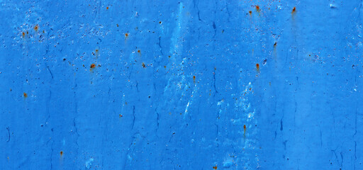Beautiful cracked blue paint on rusty iron