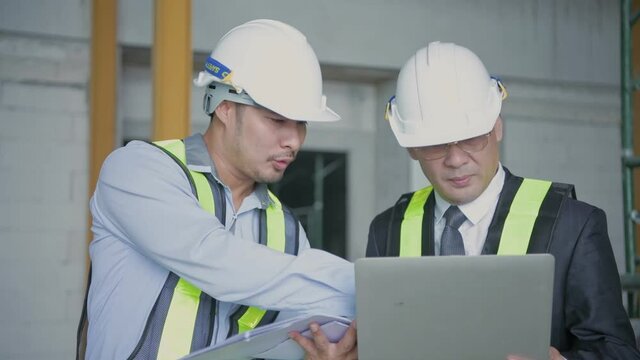 Engineer concept. Business people discuss work on building extension. 4k Resolution.