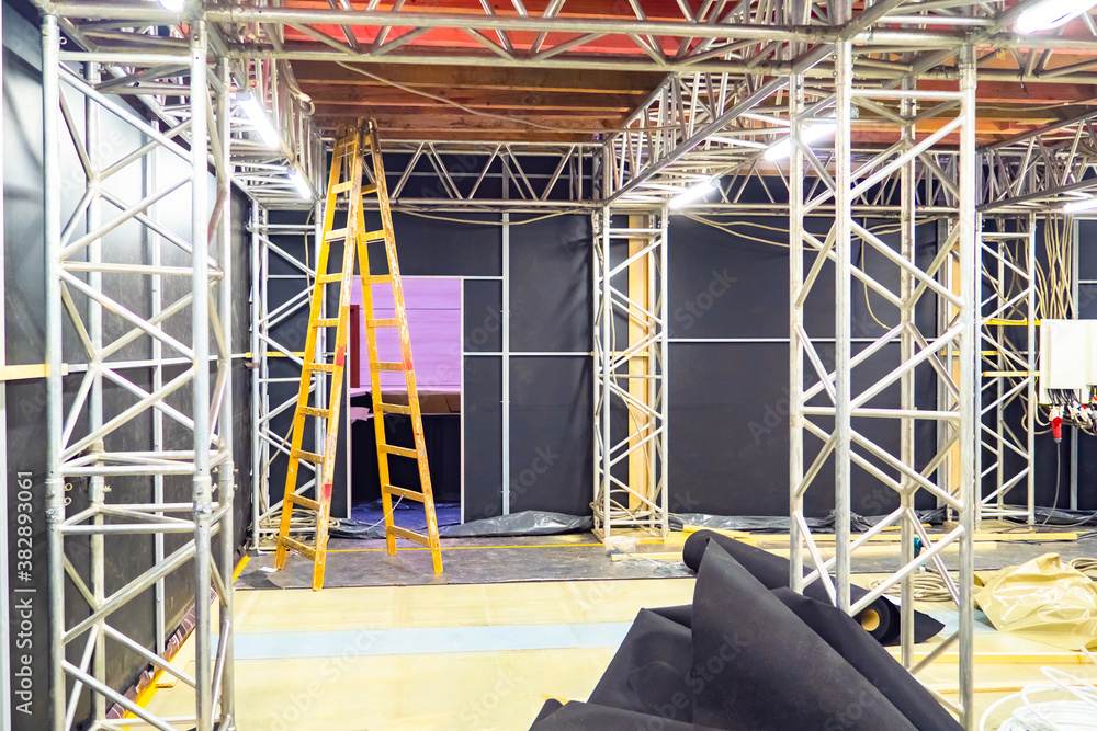 Poster collapsible scaffolding in an office building. repairs of internal premises. zoning of space. instal