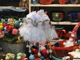 Hande made white angels and other nice gifts on the christmas market in Budapest, Hungary