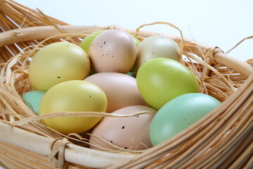 Easter colored eggs in basket 