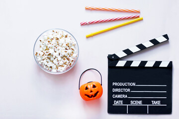 Still life top view. Movie Clapperboard next to the Halloween pumpkin. Jack O 'Lantern, pumpkin...