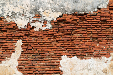 Ancient old brick wall made of red brick.
