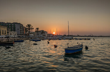 Fototapeta premium Italian harbor at sunset. The coastal town of Molfetta.