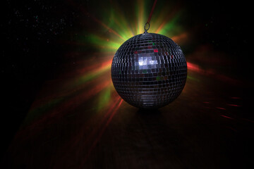 Colorful disco mirror ball lights night club background. Party lights disco ball. Selective focus