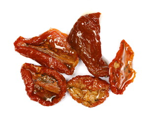 Oiled sun-dried tomatoes isolated on white background, top view