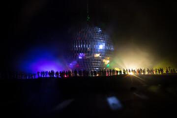 Colorful disco mirror ball lights night club background. Party lights disco ball. Selective focus