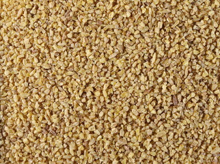 Dry bulgur pile background and texture, top view  