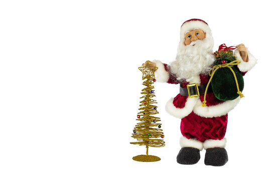 Santa Claus in a red suit and a big bag of gifts with a golden Christmas tree on a white background, place for text.