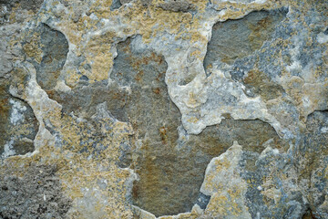 stone wall of unusual texture and color
