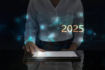 Business woman works on digital screen about 2025