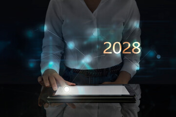 Business woman works on digital screen about 2028