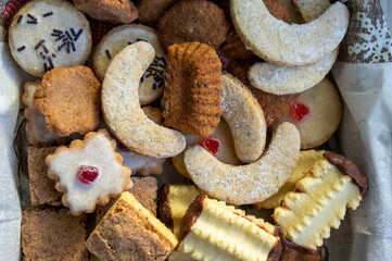 Group of delicious sweet Christmas cookies, white vanilla rolls, gingerbread, linzer and chocolate sweets wiht jam filling
