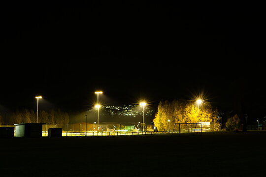 An image of stadium at night time
