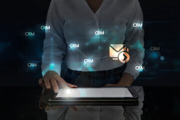 Business woman works on digital screen about Crm and e-mail