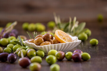 Olives on the wooden background