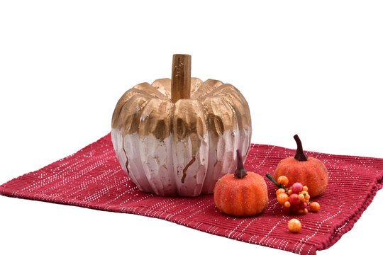 fall halloween pumpkin decoration still life isolated with berries on red mat