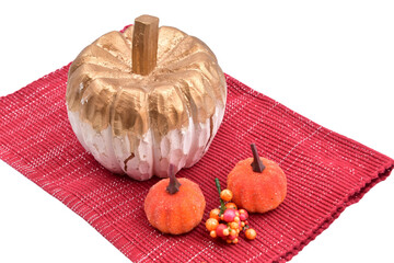 fall halloween pumpkin decoration still life isolated with berries on red mat