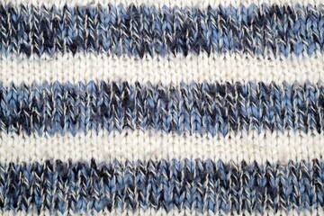 Isolated part of knitted blue and white wool plaid (background)