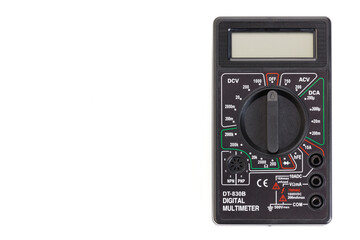 Digital electrical tester multimeter in black case isolated on white background. Digital multimeters have a numeric display, can measure voltage, current and resistance. Close-up.