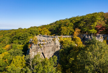 Aerial drone image of the Coopers Rock state park overlook over the Cheat River in narrow wooded gorge in the autumn towards Cheat Lake Morgantown, WV