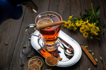 Hot mulled wine on a wooden table

