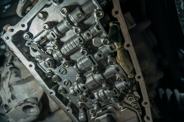 Naklejka na ściany i meble CVT gearbox close up, changing oil and maintenance in new modern variator automatic transmission on SUV in Car Service.