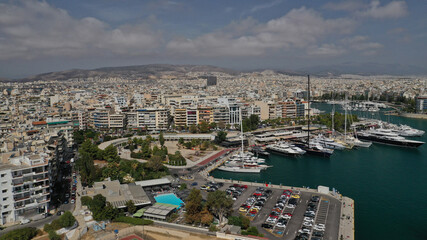 Fototapeta premium Aerial drone panoramic photo of iconic round port and marina of Zea in the heart of Piraeus with beautiful sky and clouds, Attica, Greece