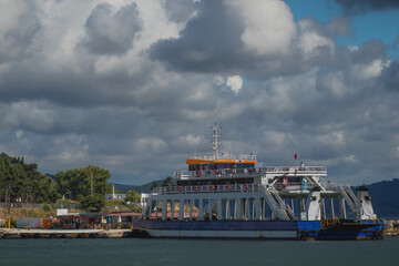 Ferry transporting people and cars through the Dardanele strait between the towns of Eceabat and...