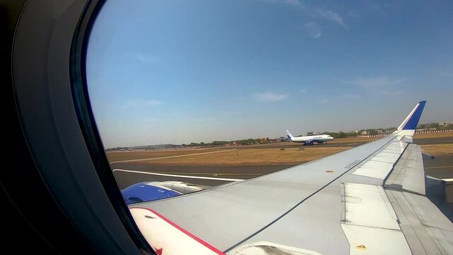 Airplane take off shot through window from inside
