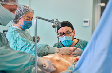 surgeon in the operating room performs the operation