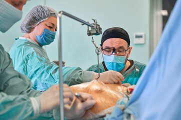 surgeon in the operating room performs the operation