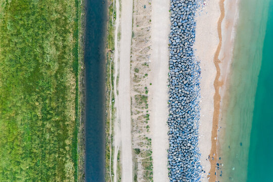 Aerial top down view of beach and  road near Milford-on-Sea, UK.