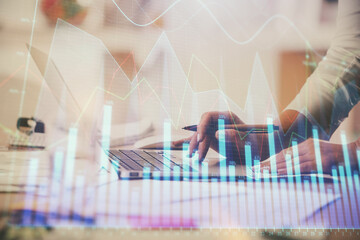 Multi exposure of woman hands typing on computer and financial chart hologram drawing. Stock market analysis concept.