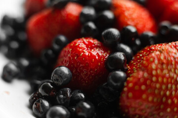picture of fresh red strawberries with a lot of blackberries