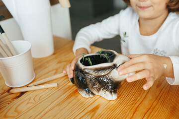 Child learning to grow their own peas at home
