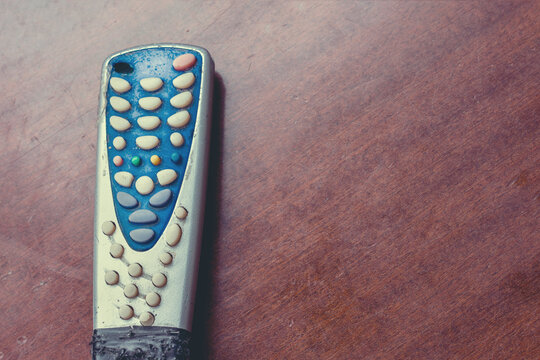 Old Broken Tv Control Remote On Wooden Table Background