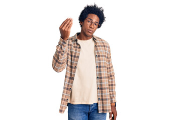 Handsome african american man with afro hair wearing casual clothes and glasses doing italian gesture with hand and fingers confident expression