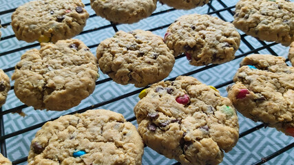 Chocolate chip oatmeal monster cookies on a cooling rack 