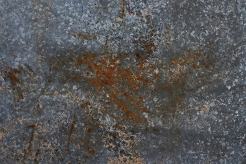 Rusty stains on a gray galvanized metal surface
