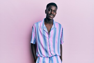 Young african american man wearing casual clothes smiling with a happy and cool smile on face. showing teeth.