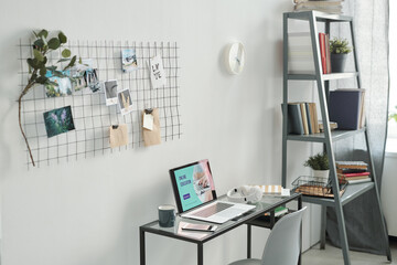 Workplace of contemporary young student consisting of educational supplies