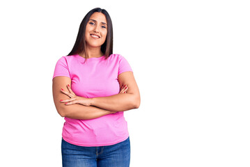 Young beautiful brunette woman wearing casual t-shirt happy face smiling with crossed arms looking at the camera. positive person.