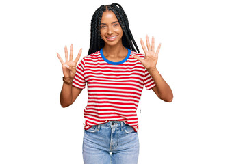 Obraz na płótnie Canvas Beautiful hispanic woman wearing casual clothes showing and pointing up with fingers number nine while smiling confident and happy.