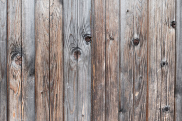 Vertical background from gorizontal grey boards of natural aged wood