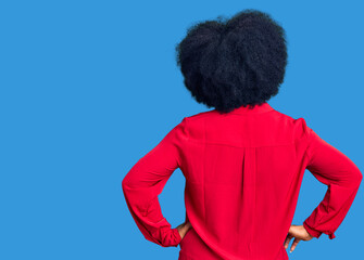 Young african american girl wearing casual clothes standing backwards looking away with arms on body